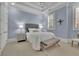 Inviting bedroom with a neutral color palette and comfortable furniture at 4084 Peachtree Dunwoody Rd, Atlanta, GA 30342