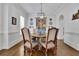 Dining room with a round table and decorative china at 4084 Peachtree Dunwoody Rd, Atlanta, GA 30342