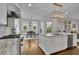 Bright kitchen with granite countertops, stainless appliances, and an island at 4084 Peachtree Dunwoody Rd, Atlanta, GA 30342