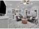 Finished living room with a full bar, open shelving, large sofa, and backyard access at 4084 Peachtree Dunwoody Rd, Atlanta, GA 30342