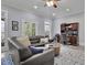 Finished living room with an office space, large sofa, and backyard access at 4084 Peachtree Dunwoody Rd, Atlanta, GA 30342