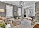 Comfortable living room with gray walls, white trim, and hardwood floors at 4084 Peachtree Dunwoody Rd, Atlanta, GA 30342