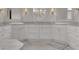 Dual sinks and vanities grace the bathroom, alongside drawers, mirrors, and light at 4084 Peachtree Dunwoody Rd, Atlanta, GA 30342