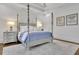 Beautiful main bedroom featuring a four-poster bed and neutral decor at 4084 Peachtree Dunwoody Rd, Atlanta, GA 30342