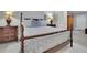 A spacious staged main bedroom featuring beautiful floors and ample natural light at 4084 Peachtree Dunwoody Rd, Atlanta, GA 30342