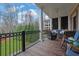 Enjoy the outdoors on this covered porch with views of the lush, green backyard at 4084 Peachtree Dunwoody Rd, Atlanta, GA 30342