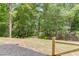 Lush backyard showcasing mature trees and open space creating a private outdoor retreat at 4459 Grady Smith Rd, Loganville, GA 30052
