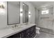 Modern bathroom featuring double vanity with marble countertop and a luxurious walk-in shower at 4459 Grady Smith Rd, Loganville, GA 30052