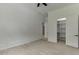 Bright bedroom with hardwood floors, a walk-in closet, and a door to another room at 4459 Grady Smith Rd, Loganville, GA 30052