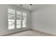 Bright bedroom with three large windows offering an airy feel and lots of natural light at 4459 Grady Smith Rd, Loganville, GA 30052