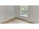 Bright bedroom featuring hardwood floors and a window offering natural light at 4459 Grady Smith Rd, Loganville, GA 30052