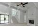 Grand foyer with staircase, coffered ceiling, fireplace, and bright natural light streaming through windows at 4459 Grady Smith Rd, Loganville, GA 30052