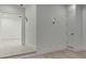 Bright hallway features a wooden floor with custom lighting and wall details leading to an open room at 4459 Grady Smith Rd, Loganville, GA 30052