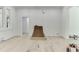 Bright living room featuring hard wood flooring, large window, and lots of natural light at 4459 Grady Smith Rd, Loganville, GA 30052