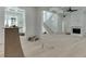 Bright living room with hardwood flooring, a fireplace, coffered ceilings, and large windows at 4459 Grady Smith Rd, Loganville, GA 30052