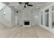 Living room boasting detailed trim, coffered ceilings, a fireplace, and multiple entry ways at 4459 Grady Smith Rd, Loganville, GA 30052
