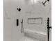 Luxurious walk-in shower with marble tile and modern fixtures at 4459 Grady Smith Rd, Loganville, GA 30052