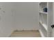 Spacious storage room with built-in shelving for organizing and storing household items at 4459 Grady Smith Rd, Loganville, GA 30052