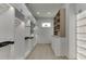 Spacious walk-in closet features custom shelving, drawers, and ample hanging space with modern lighting at 4459 Grady Smith Rd, Loganville, GA 30052