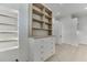 Walk-in closet featuring custom shelving with drawers for convenient storage options at 4459 Grady Smith Rd, Loganville, GA 30052