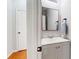 Compact bathroom features sleek vanity and mirror at 5728 Williams Rd, Norcross, GA 30093