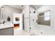 Stylish bathroom boasts a glass-enclosed shower with tile accents and contemporary vanity at 5728 Williams Rd, Norcross, GA 30093