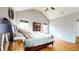 Cozy bedroom featuring natural light, ceiling fan, wood floors, and elegant decor at 5728 Williams Rd, Norcross, GA 30093