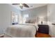 Inviting bedroom boasts wood floors, a ceiling fan, and windows that bathe the room in natural light at 5728 Williams Rd, Norcross, GA 30093