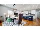 Stylish dining area with modern lighting and adjacent kitchen at 5728 Williams Rd, Norcross, GA 30093