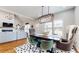 Open dining area with modern lighting and hardwood floors at 5728 Williams Rd, Norcross, GA 30093