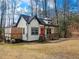 Beautifully designed home featuring a bright orange door and a spacious wooden deck for outdoor living at 5728 Williams Rd, Norcross, GA 30093