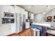 Modern kitchen features stainless steel appliances, custom cabinets, and an island with a countertop at 5728 Williams Rd, Norcross, GA 30093