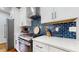 Modern kitchen with stainless steel appliances and backsplash at 5728 Williams Rd, Norcross, GA 30093