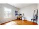Bright office space with hardwood floors, a large window, and a modern desk setup at 5728 Williams Rd, Norcross, GA 30093