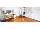 Office area featuring hardwood floors, large monitor, a desk and a tall mirror at 5728 Williams Rd, Norcross, GA 30093