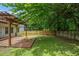 Large fenced backyard featuring a wood deck and nice green grass at 1245 Ladd Sw St, Atlanta, GA 30310