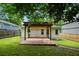 A nice backyard with a cozy deck and wooden pergola offers a private outdoor retreat at 1245 Ladd Sw St, Atlanta, GA 30310