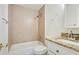 Bathroom featuring a combination shower-tub, tiled shower, and granite countertops at 1245 Ladd Sw St, Atlanta, GA 30310