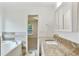 Bathroom boasting granite countertops, tile accents, and access to another room at 1245 Ladd Sw St, Atlanta, GA 30310