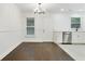 Bright dining area featuring dark wood floors, white walls, and modern chandelier at 1245 Ladd Sw St, Atlanta, GA 30310