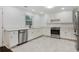Bright kitchen with white cabinetry, stainless steel appliances, and tile floors at 1245 Ladd Sw St, Atlanta, GA 30310