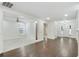 Open-concept living room with hardwood floors, large windows, and a seamless flow at 1245 Ladd Sw St, Atlanta, GA 30310
