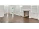 Spacious living room with hardwood floors, fireplace, and built-in cabinetry at 1245 Ladd Sw St, Atlanta, GA 30310