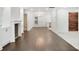 Open-concept living room with hardwood floors, built-in shelving and abundant natural light at 1245 Ladd Sw St, Atlanta, GA 30310