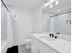 Bathroom features a vanity with a sink, subway tile shower with tub, and modern lighting at 145 Millennial Ct, Lawrenceville, GA 30045