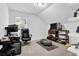 Bedroom features a window for natural light, carpet floor, and shelf decor at 145 Millennial Ct, Lawrenceville, GA 30045