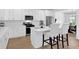 Charming kitchen features stainless steel appliances, modern fixtures, and white cabinetry at 145 Millennial Ct, Lawrenceville, GA 30045