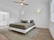Well-lit main bedroom features high ceilings and an ensuite bathroom with a shower and vanity at 145 Millennial Ct, Lawrenceville, GA 30045