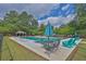 Inviting community pool area with comfortable lounge chairs and shaded seating, perfect for summer relaxation at 145 Millennial Ct, Lawrenceville, GA 30045