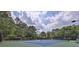 Well-maintained community tennis court with professional lighting and comfortable seating for spectators at 145 Millennial Ct, Lawrenceville, GA 30045